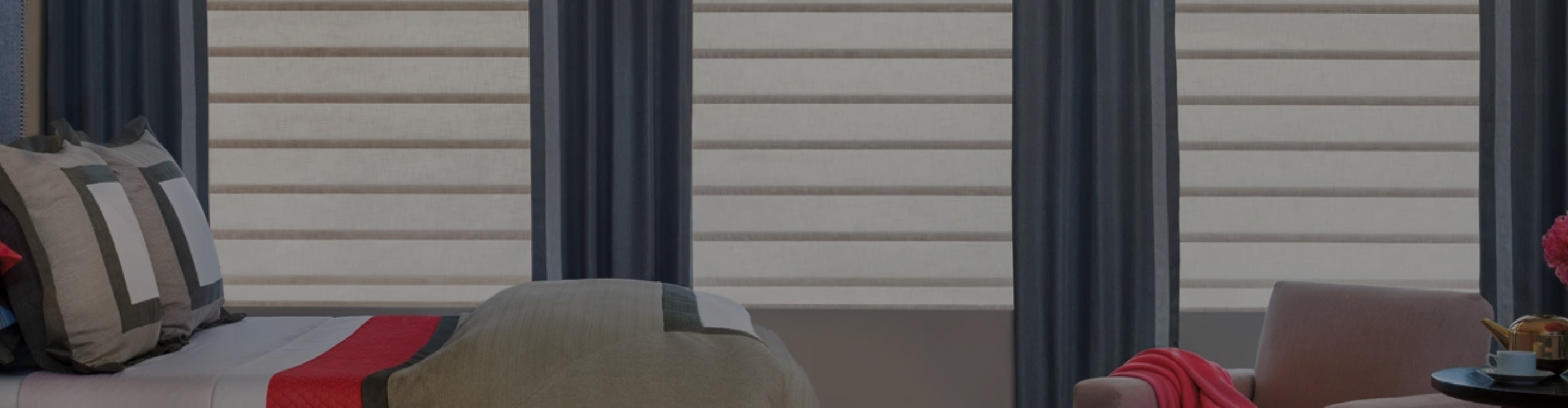 Hunter Douglas Window treatments with blue curtains.